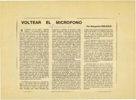 
Voltear el micrófono.


